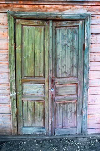Old door painte in green and blue color